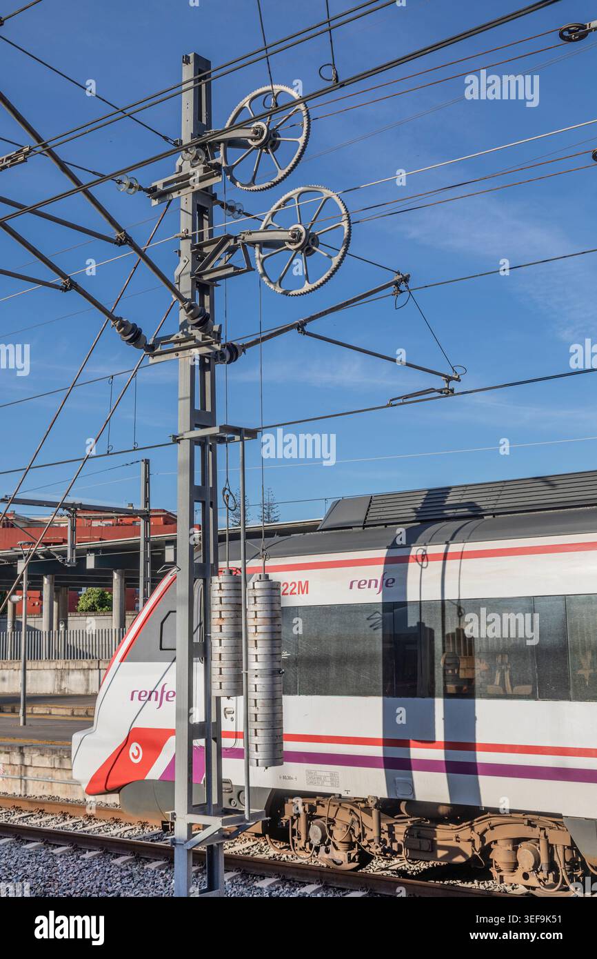 Tension weights for overhead electic railway cables. Stock Photo