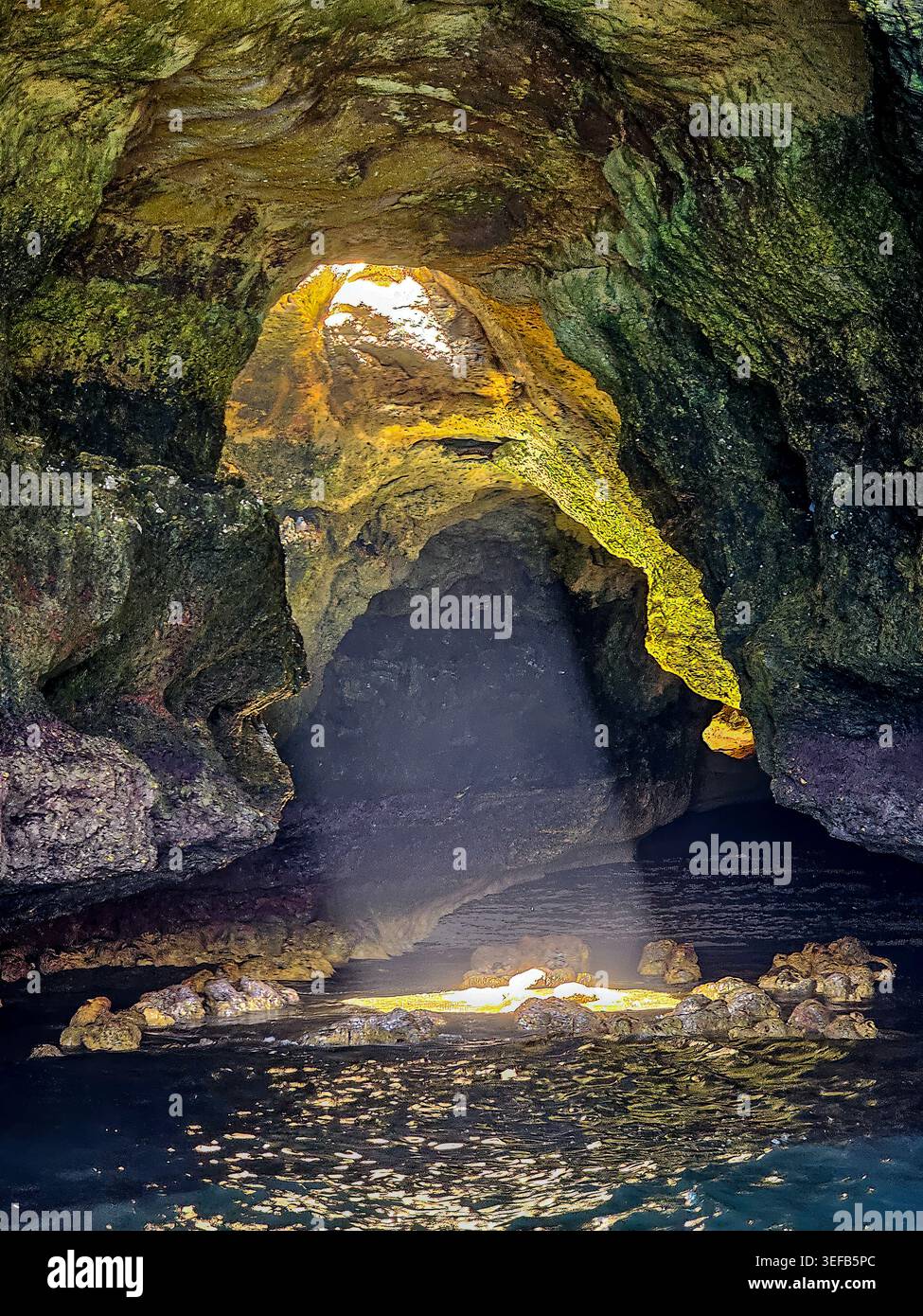 Discover seacaves along the coastline of Carvoeiro in Algarve Portugal during a sunny day Stock Photo