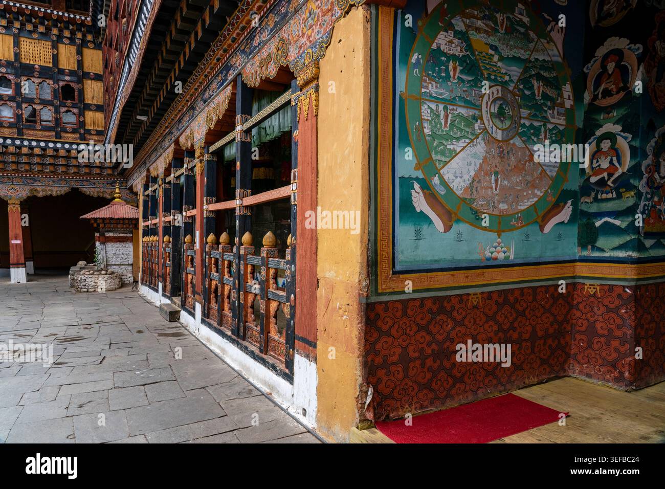 Exploring Rinpong Dzong Monastery with colorful murals and traditional architecture in Paro Bhutan Stock Photo