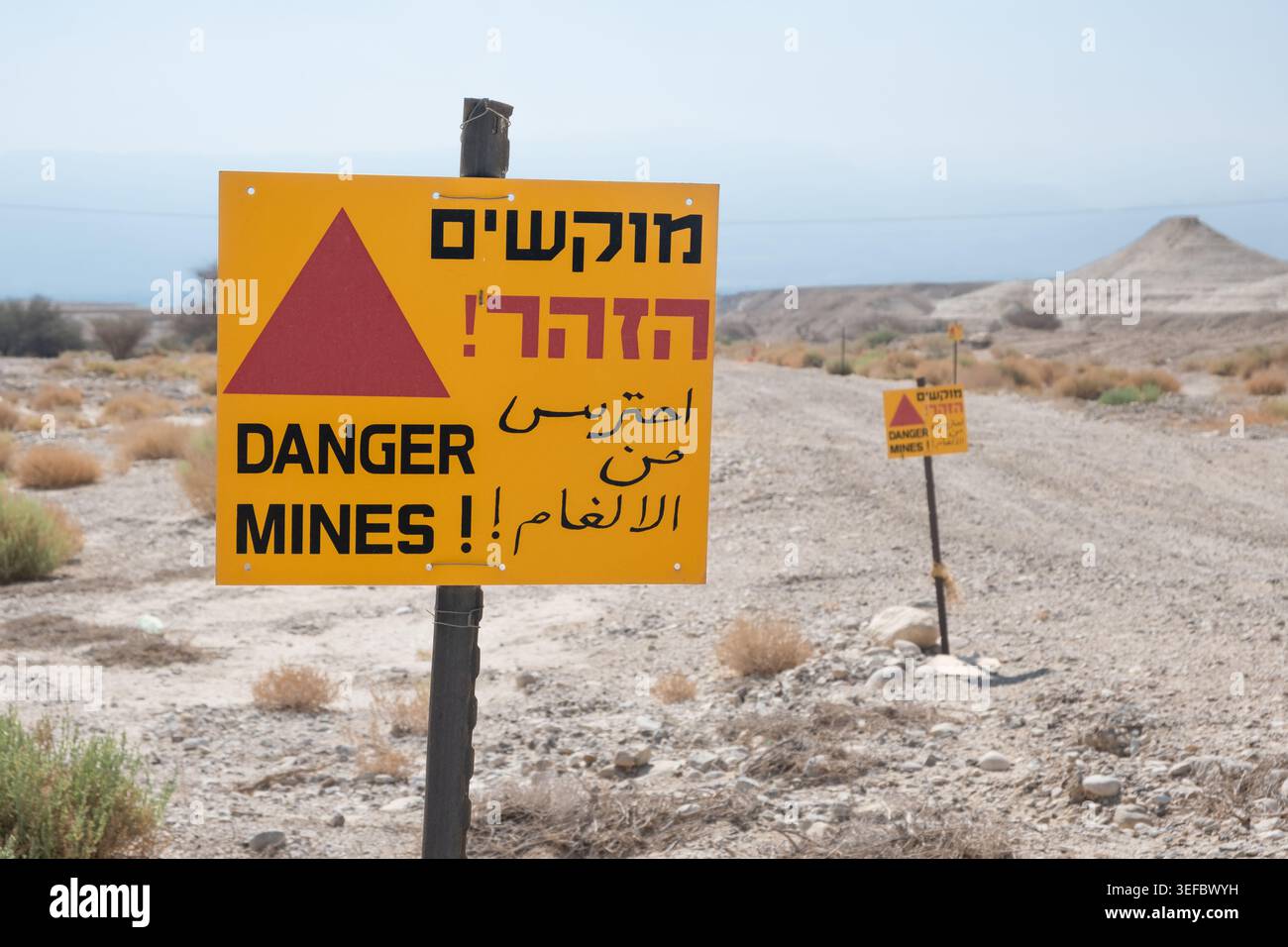 Israeli Border Sign Warning sign for a minefield displays Hebrew English and Arabic letters ...