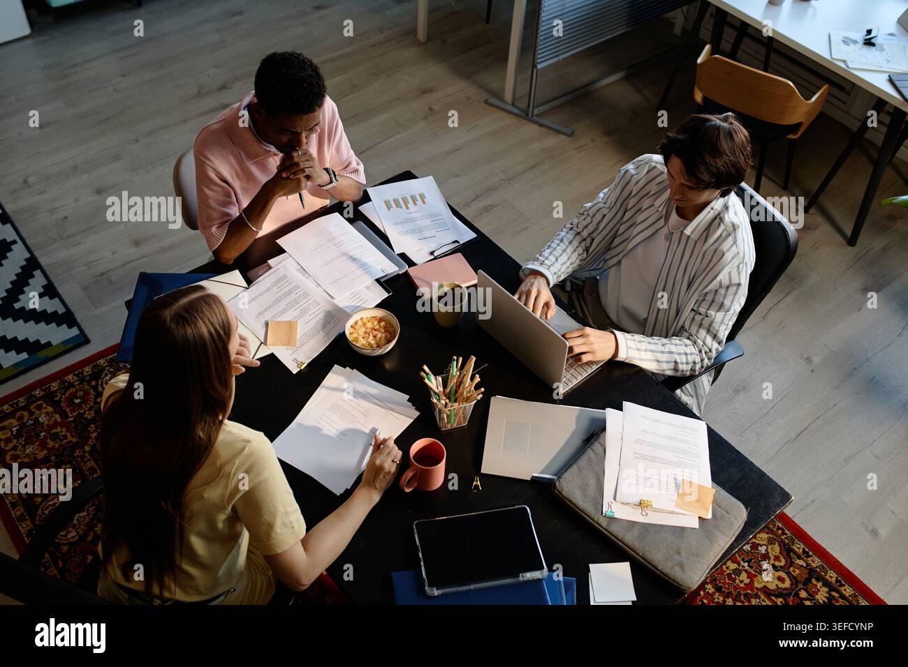 Diverse Business Team Collaborating on Office Project Planning Stock Photo