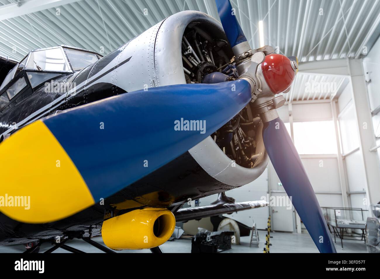 Closeup of vintage aircraft propeller and radial engine inside bright ...