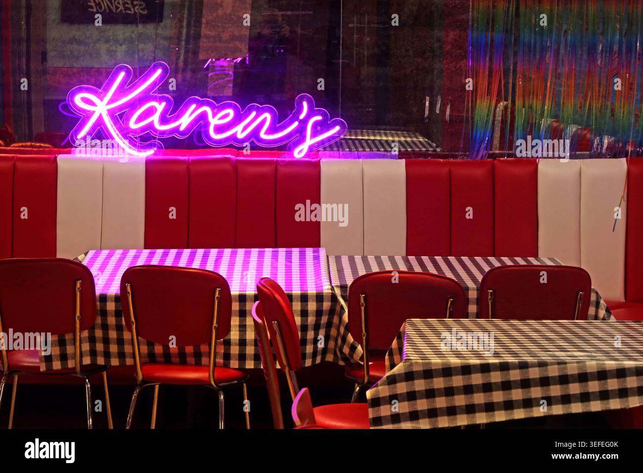 Karen's Diner neon sign and retro seating in Birmingham, West Midlands, England, UK. Stock Photo