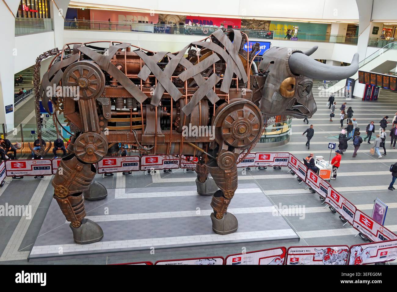 Ozzy the Bull mechanical sculpture inside Birmingham New Street station, Birmingham, England, UK. Stock Photo