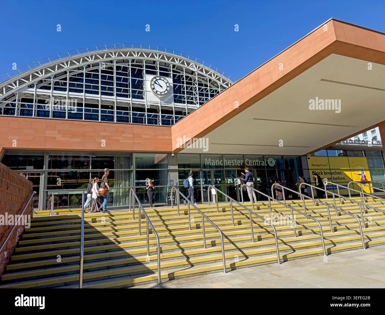 Visitors outside Manchester Central, the former G-MEX venue and Victorian railway terminus in Manchester city centre. Stock Photo