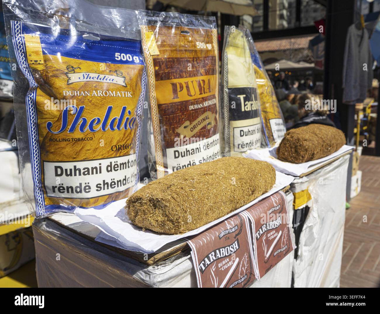 Tirana, Albania. March 2023. selling pouches of tobacco at a stall in an  open-air market in the city centre Stock Photo