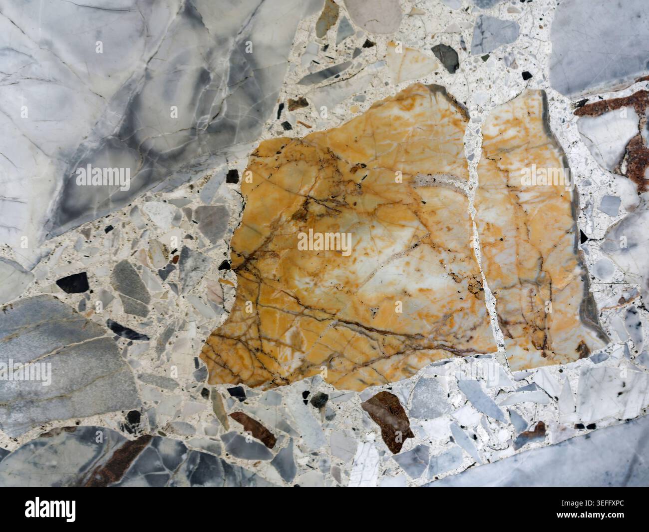 Golden Marble with Dramatic Yellow Fragments Stock Photo