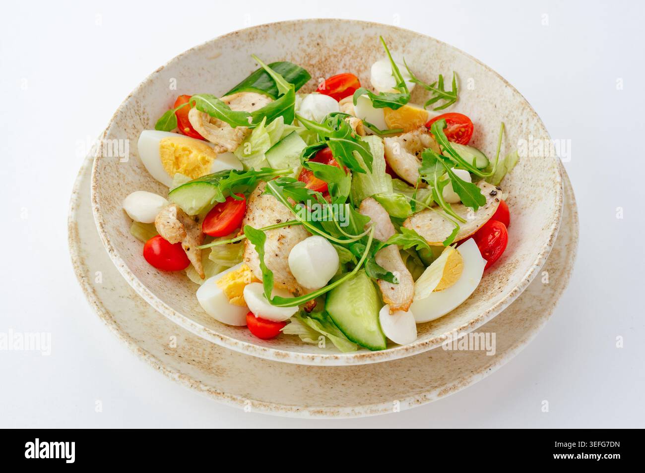 A fresh grilled chicken salad with eggs and vegetables Stock Photo