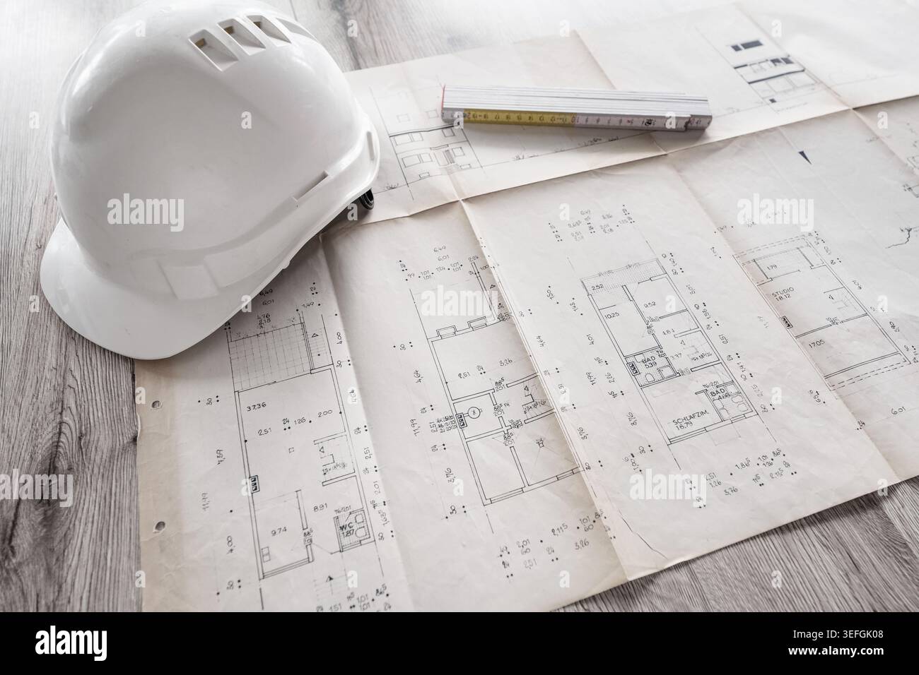 Architect rolls and architectural plan,technical project drawing Stock Photo