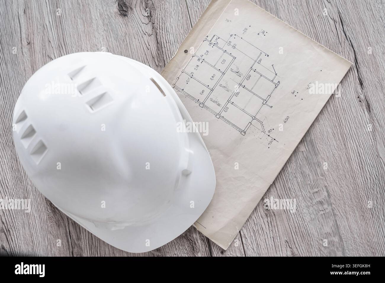 Architect rolls and architectural plan,technical project drawing Stock Photo