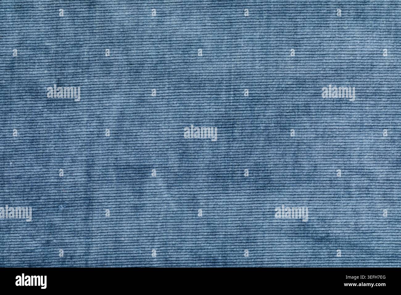 Blue corduroy fabric surface with fine ribbed texture Stock Photo