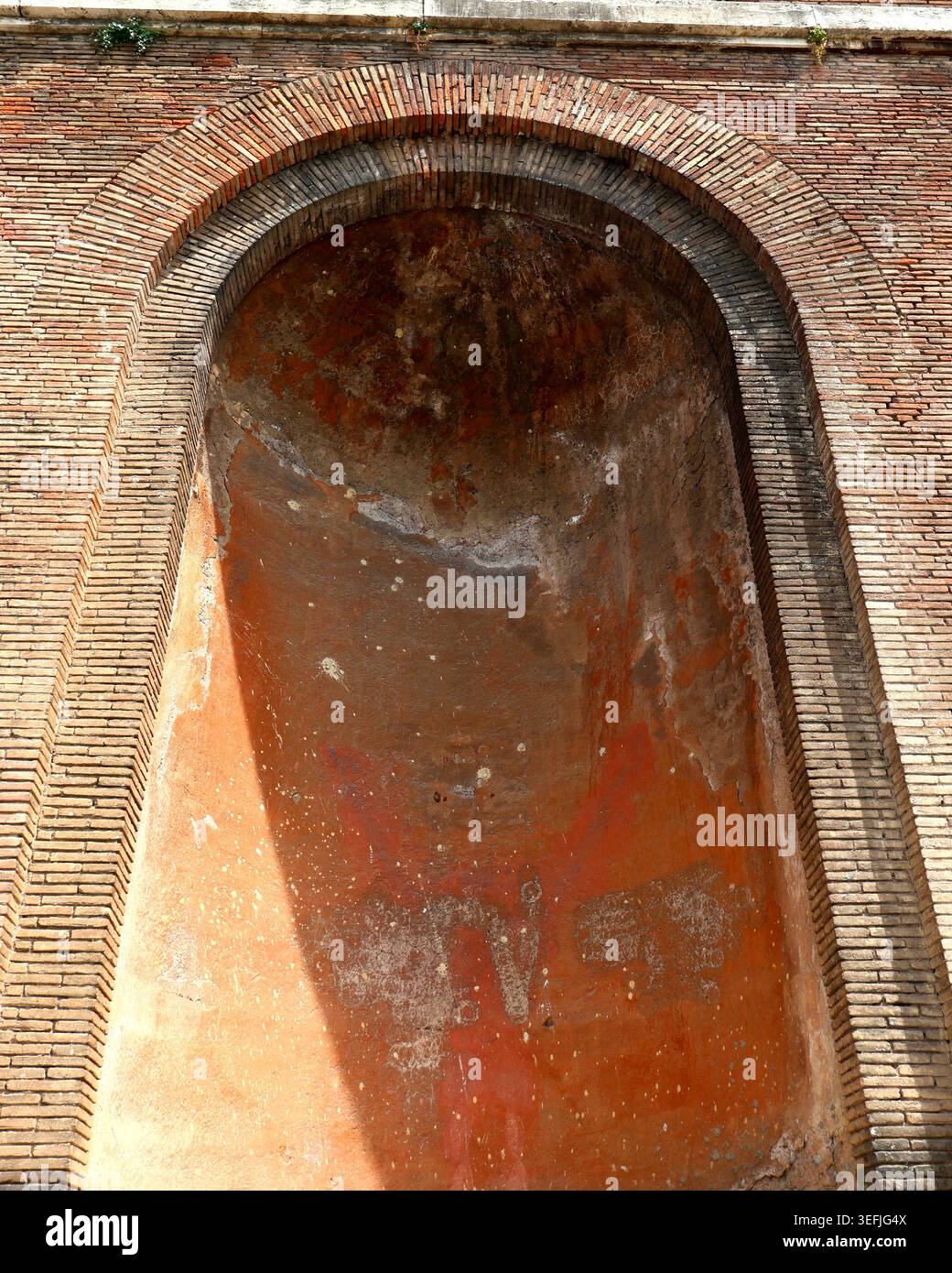Ancient Roman brick arch with weathered red plaster textures in Rome ...