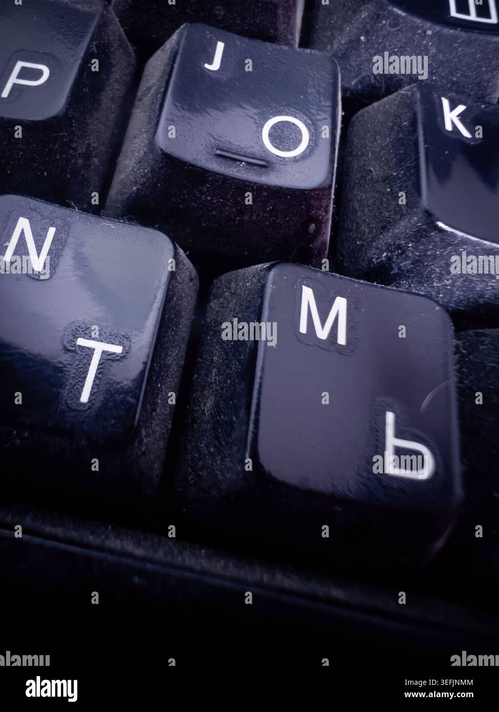 Close-up of dirty keys on a computer keyboard. Stock Photo
