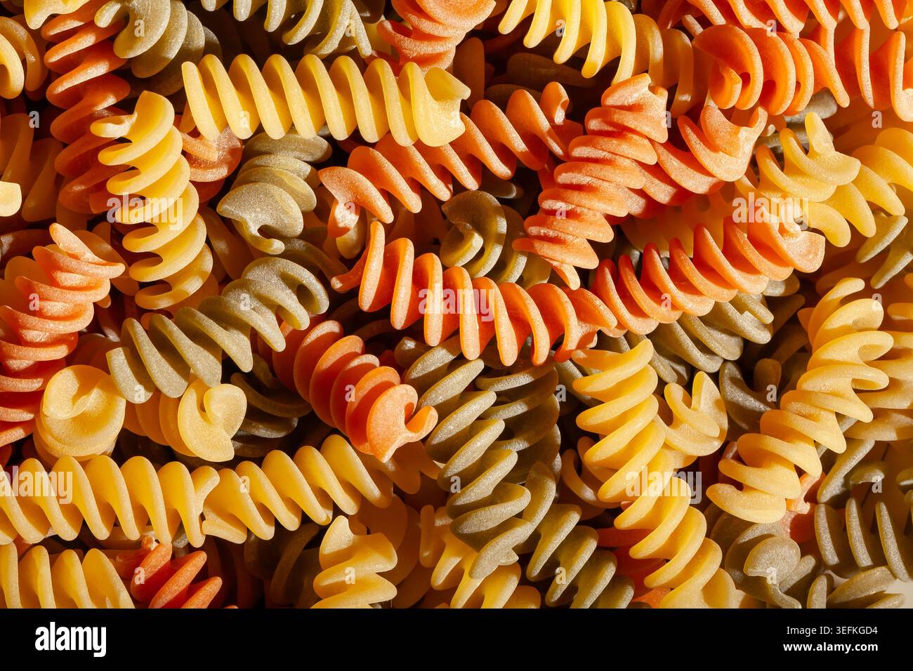 tri color pasta texture background top view Stock Photo