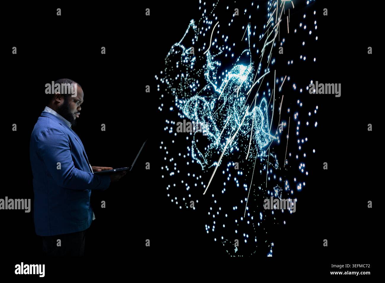Software developer researching AI algorithm clusters using laptop. African american man using notebook to study artificial intelligence neural network visualization, analyzing data processing Stock Photo