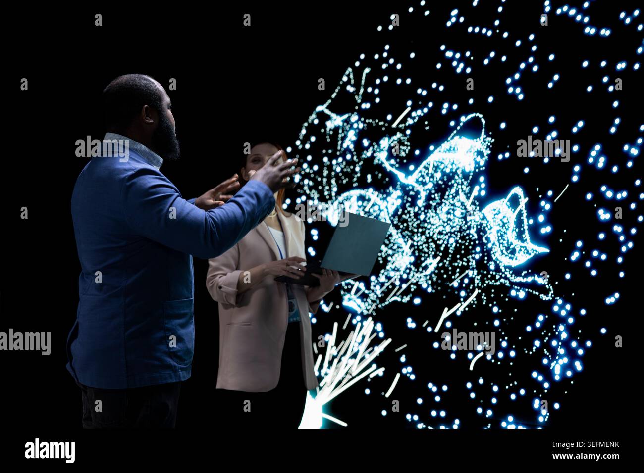 AI startup engineering team coworkers optimizing machine learning model, adjusting artificial neurons. Colleagues use device to look at neural network architecture visualization, modifying datasets Stock Photo