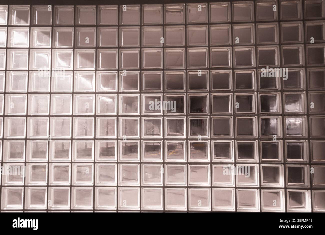 Glass block wall creating geometric abstract pattern Stock Photo