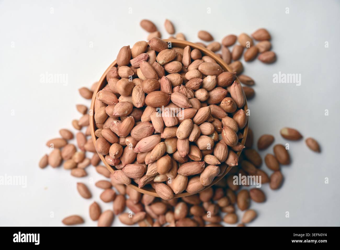 Peanuts in Bowl Top View with Defocus Backgrounds Macro Photography Stock Photo