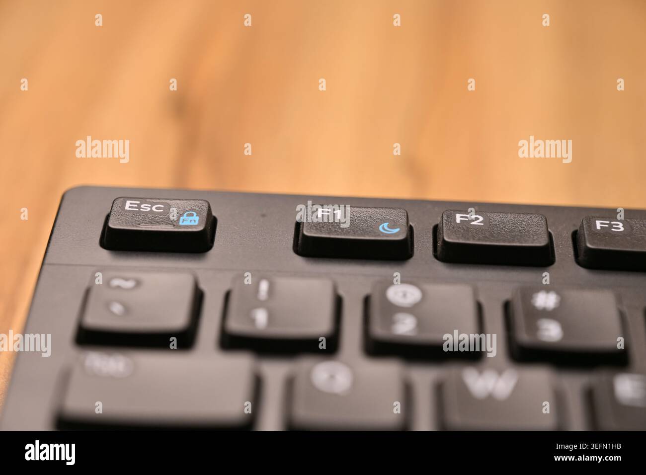 Minimal Black Keyboard Macro Compositions Highlighting F1 Function Key in Soft Focus Angled Top View Stock Photo