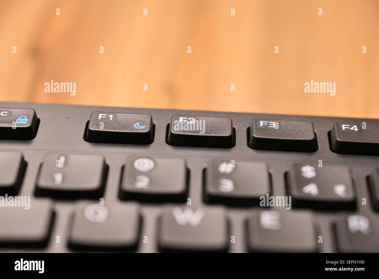 Minimal Black Keyboard Macro Compositions Highlighting F2 Function Key in Soft Focus Angled Top View Stock Photo