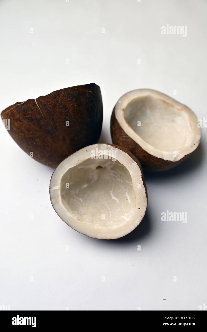 Dry Coconut Texture on White Background Angled Top View with Defocus Macro Photography Stock Photo