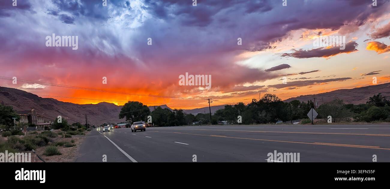 Moab, Utah - May 15, 2026: Red sky sunset to the north west of Moab, with the red-orange colors of the Arches National Park reflected in the sky - Smartphone Captured Stock Image