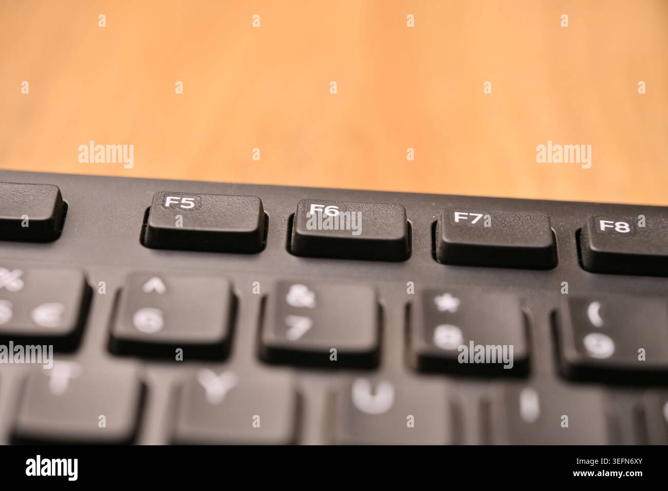 Minimal Black Keyboard Macro Compositions Highlighting F6 Function Key in Soft Focus Angled Top View Stock Photo