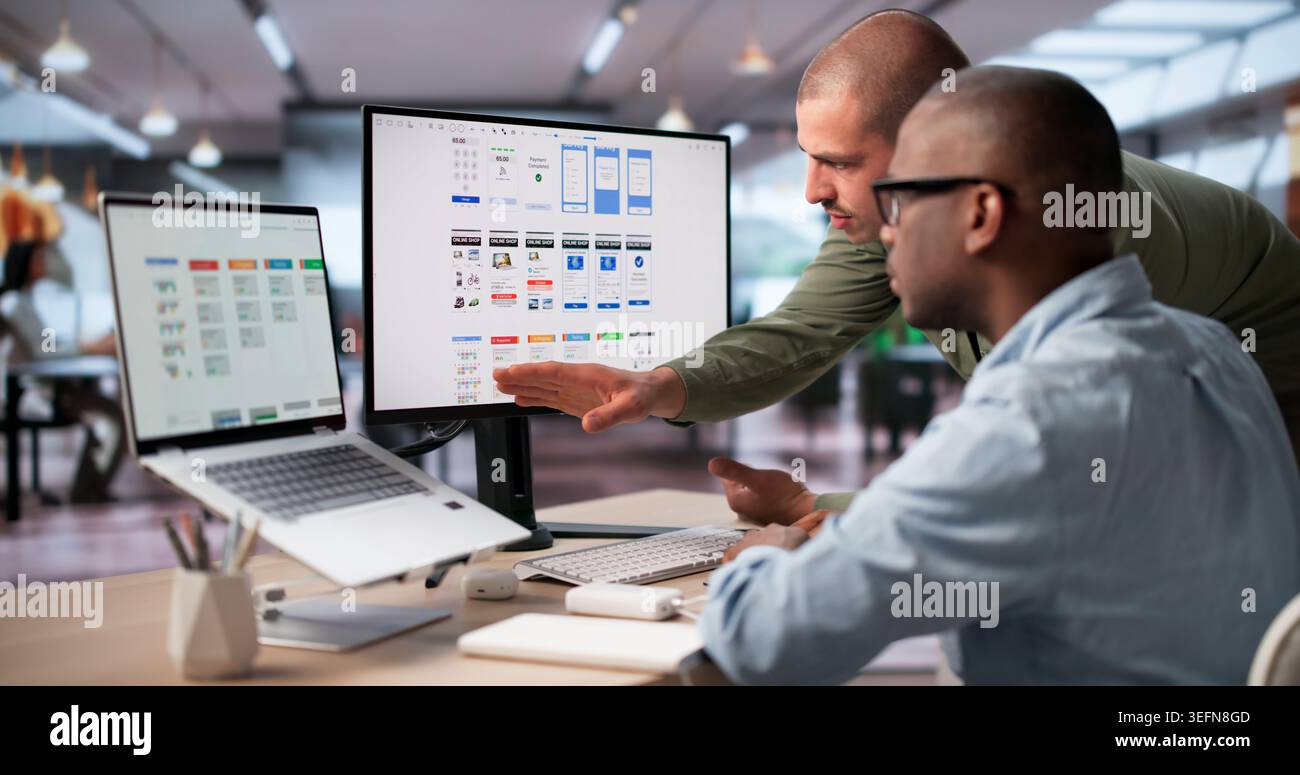 UX Designers Brainstorming Ideas Together To Improve App’s User Interface. Stock Photo