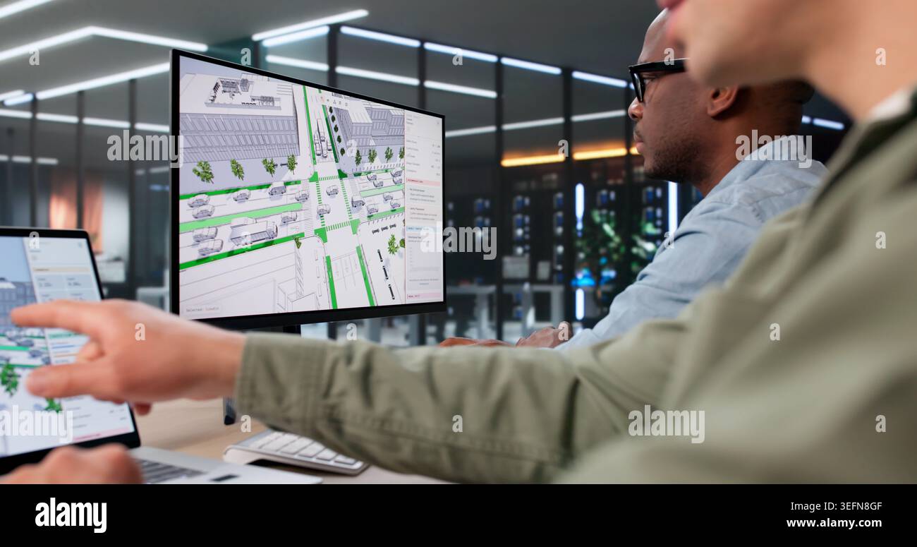 Two Civil Engineers Use 3D Software Analyzing Urban Road Traffic Flow Data. Stock Photo
