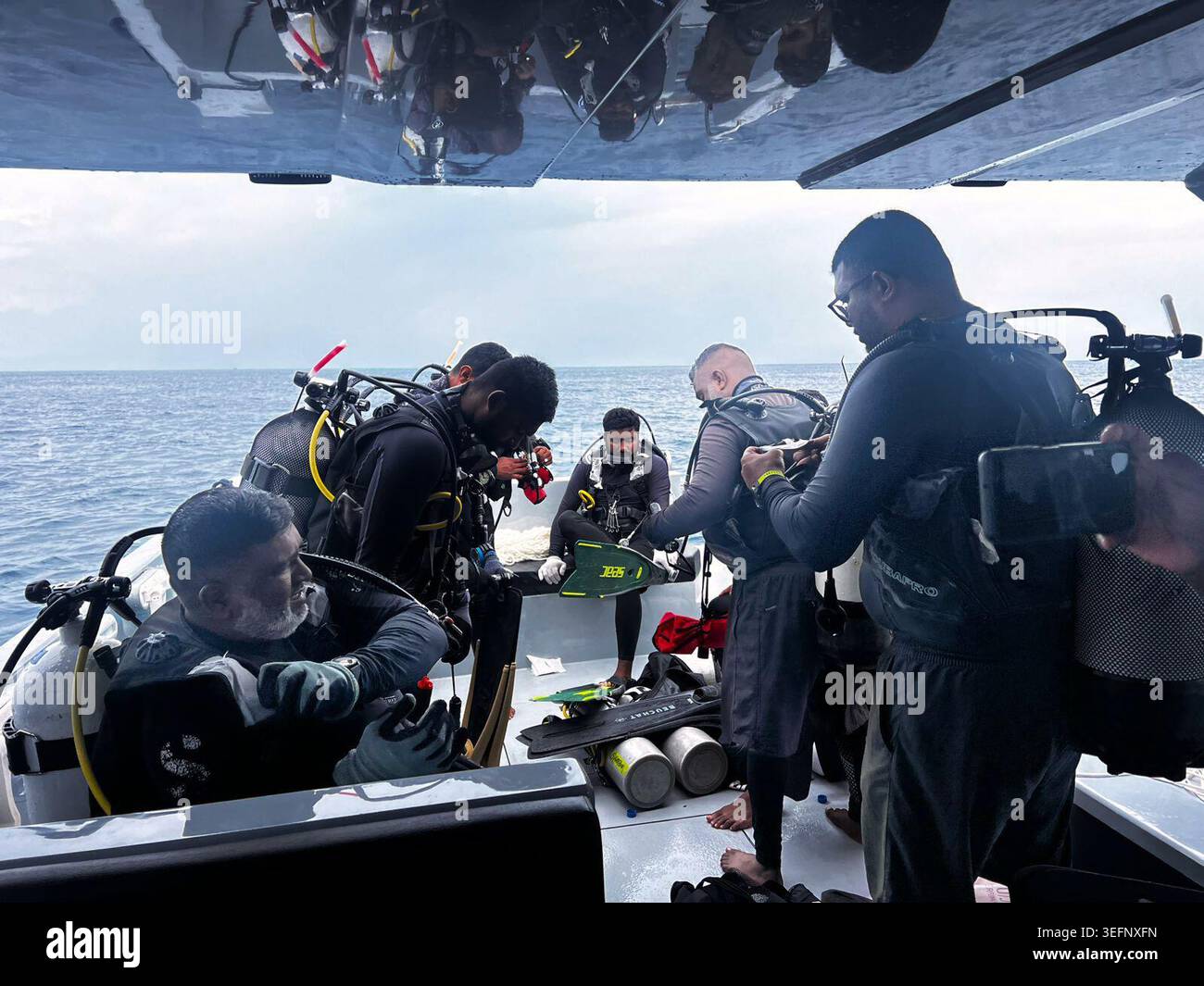 This image released by the Maldives President's Media Division, shows divers preparing to search for the four missing Italian divers near Alimathaa Island, Vaavu Atoll, Maldives, Saturday, May 15, 2026. (Maldives President's Media Division via AP) Stock Photo