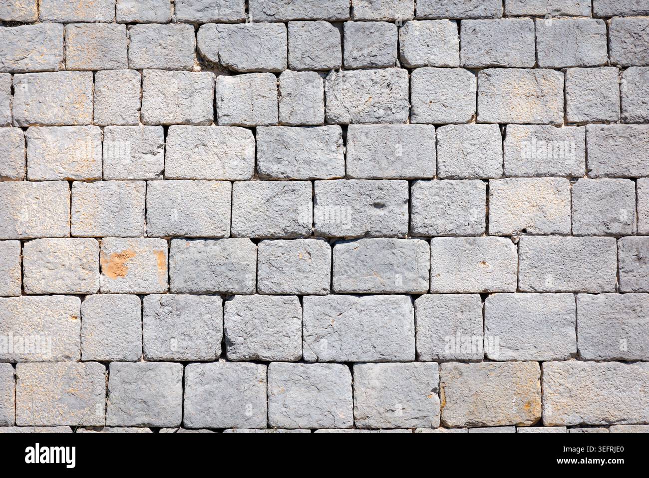 Square Grey Natural Stone Wall Texture Background. Stock Photo