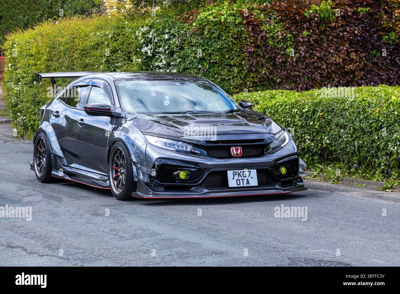A modified grey Honda Civic Type R hatchback driving past to Renntag ...