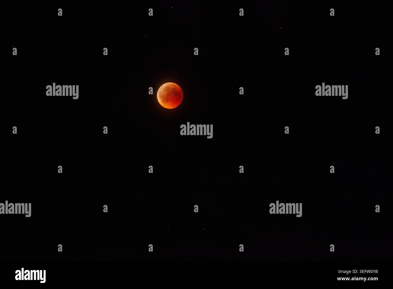 Blood moon during total lunar eclipse at night Stock Photo