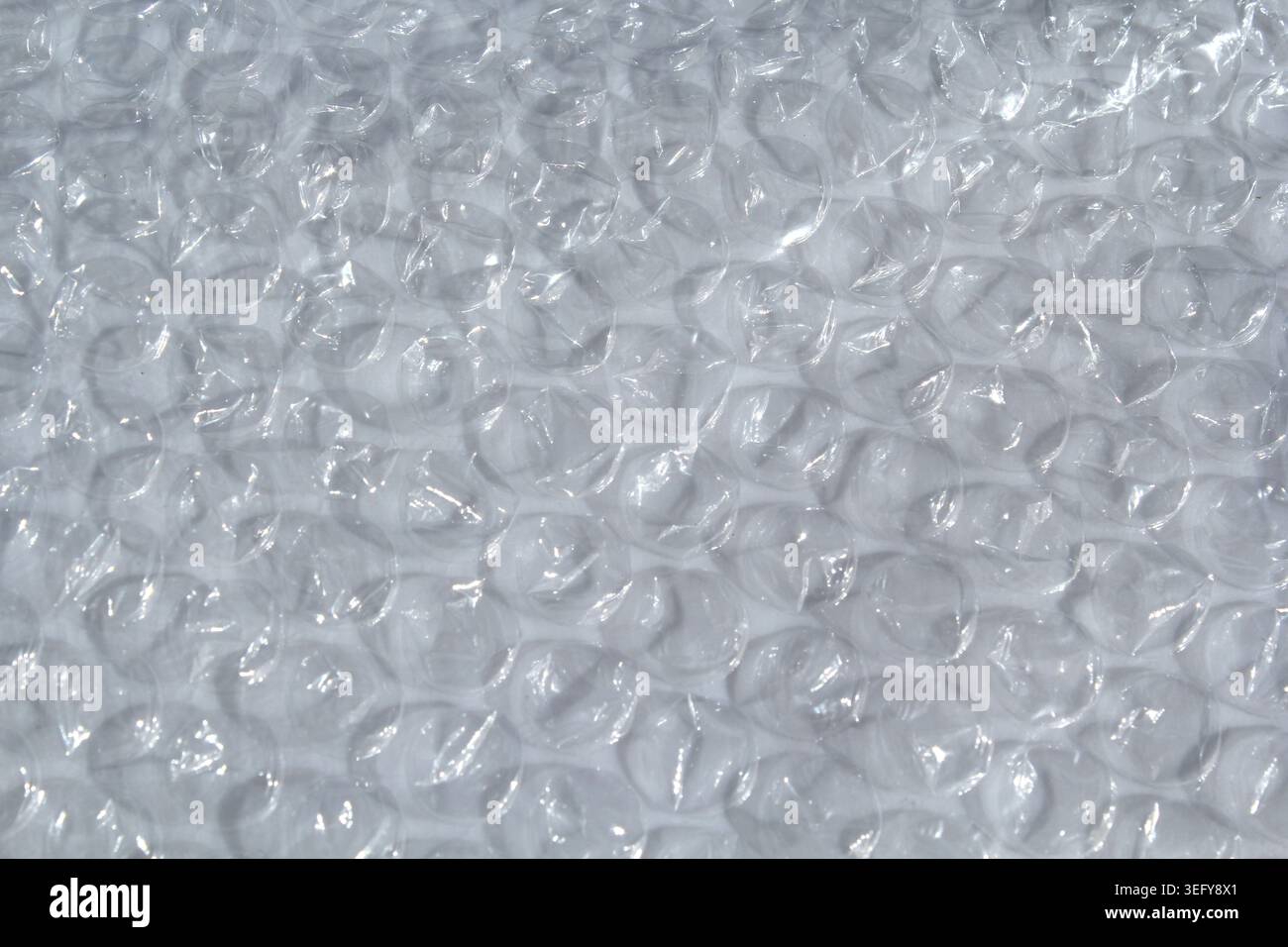 Full frame background texture of clear plastic bubble wrap packaging material Stock Photo