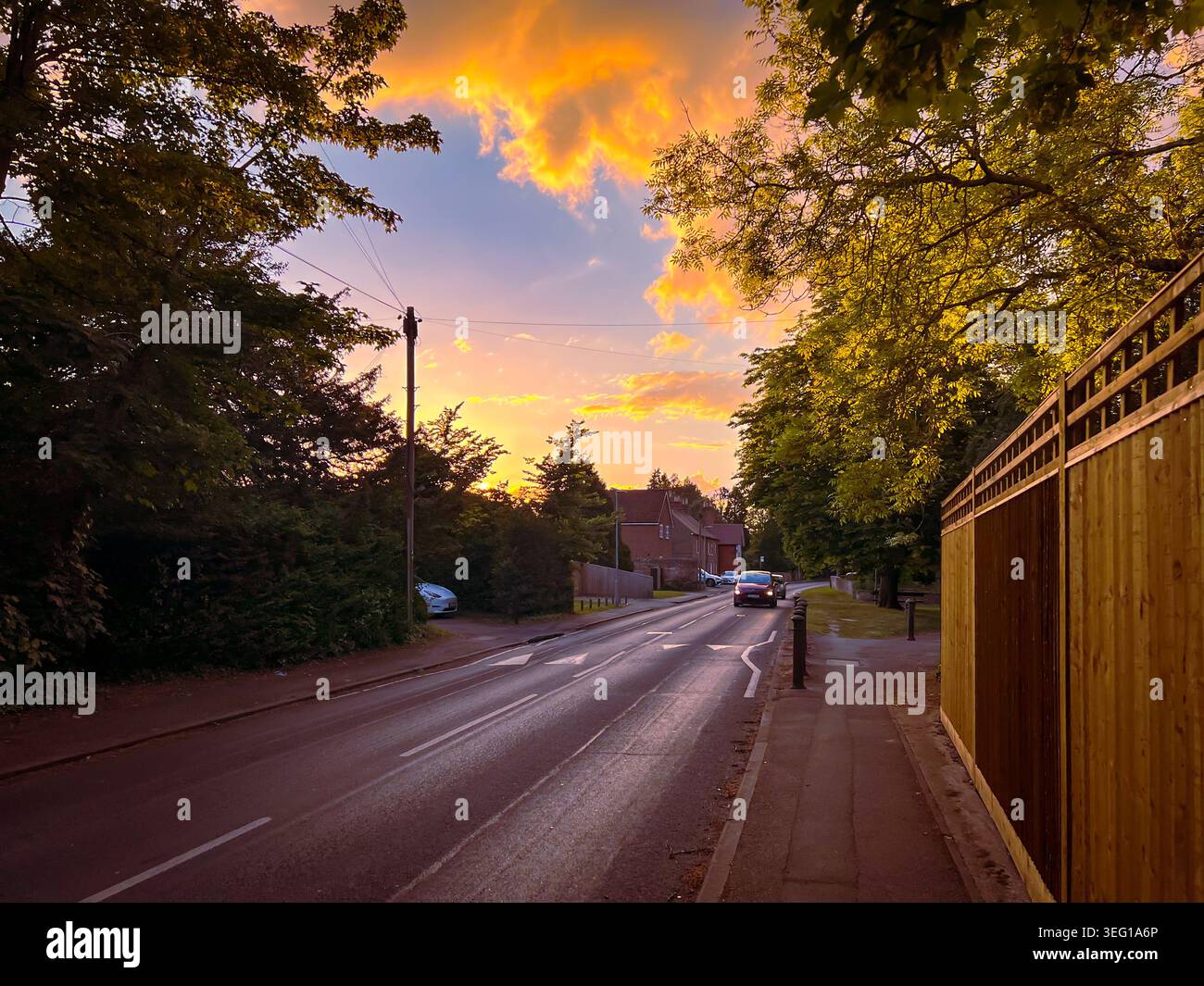 A view down New Lane Hill in Tilehurst, Reading, UK as the sun starts to set. Stock Photo