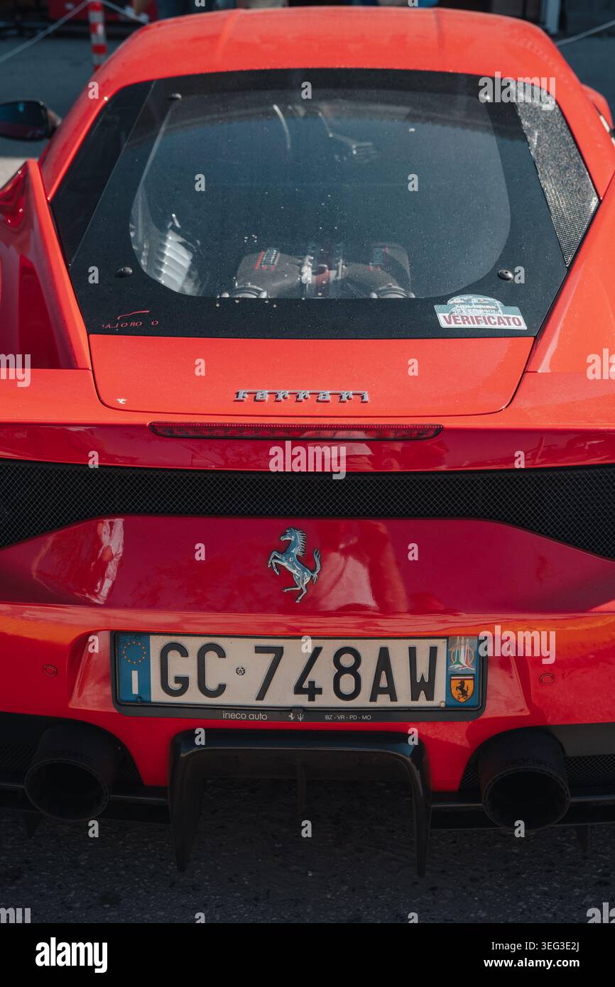 Rear view of a red Ferrari supercar showing the iconic prancing horse ...