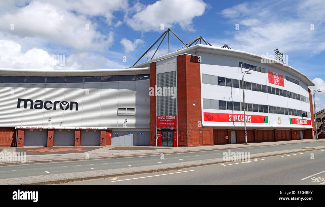 Macron Stand and Mold Road frontage of Wrexham AFC’s historic STōK Cae Ras football stadium beneath a blue summer sky, Mold Rd, Wrecsam Stock Photo