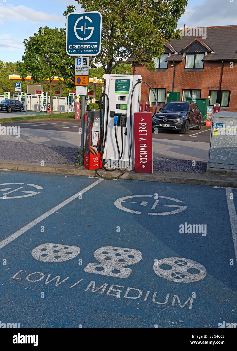 GRIDSERVE Low Medium EV chargers at Roadchef Chester M56 services highlight public charging costs, VAT concerns and range anxiety Stock Photo