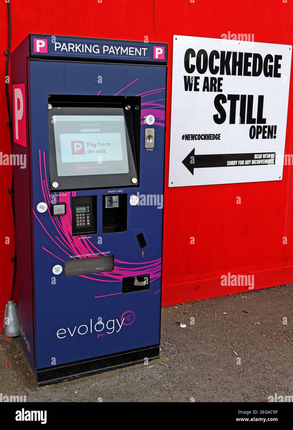 Cockhedge Shopping Centre remains open during redevelopment, with parking payment machine and signage in Warrington, Cheshire. Stock Photo