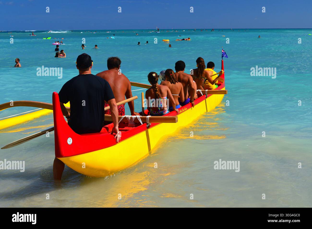 Waikiki Beach, HI, USA July 31, 2014 A tour group in a Hawaiian ...