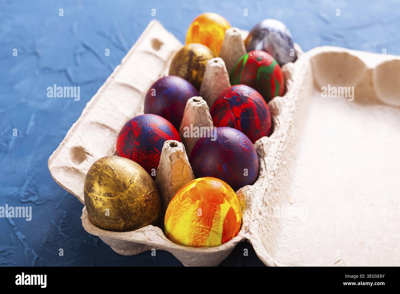 Handmade painted Easter eggs in egg box Stock Photo