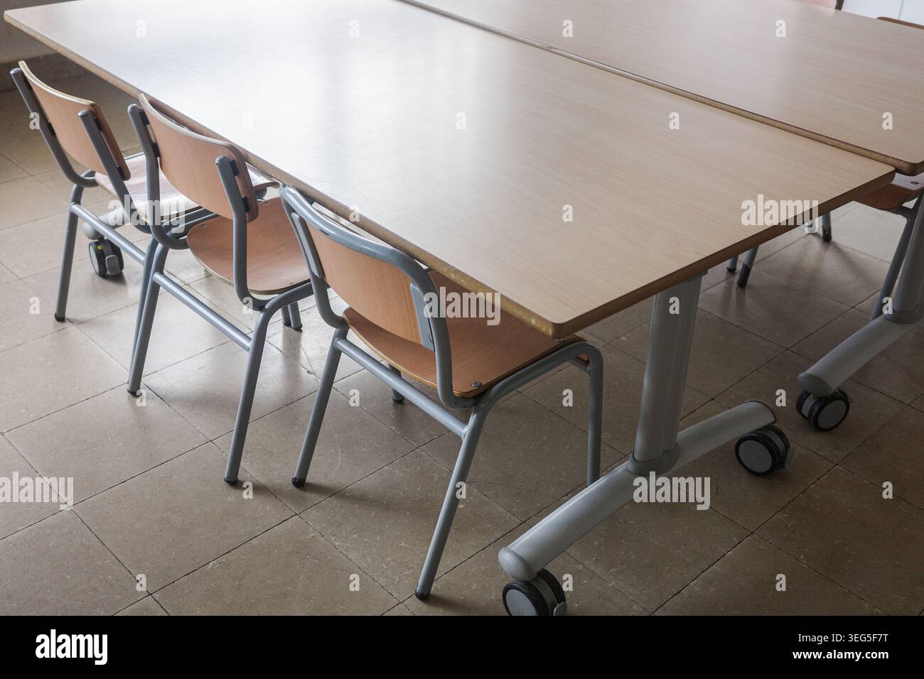 School Desks And Chairs In Empty Classroom Stock Photo