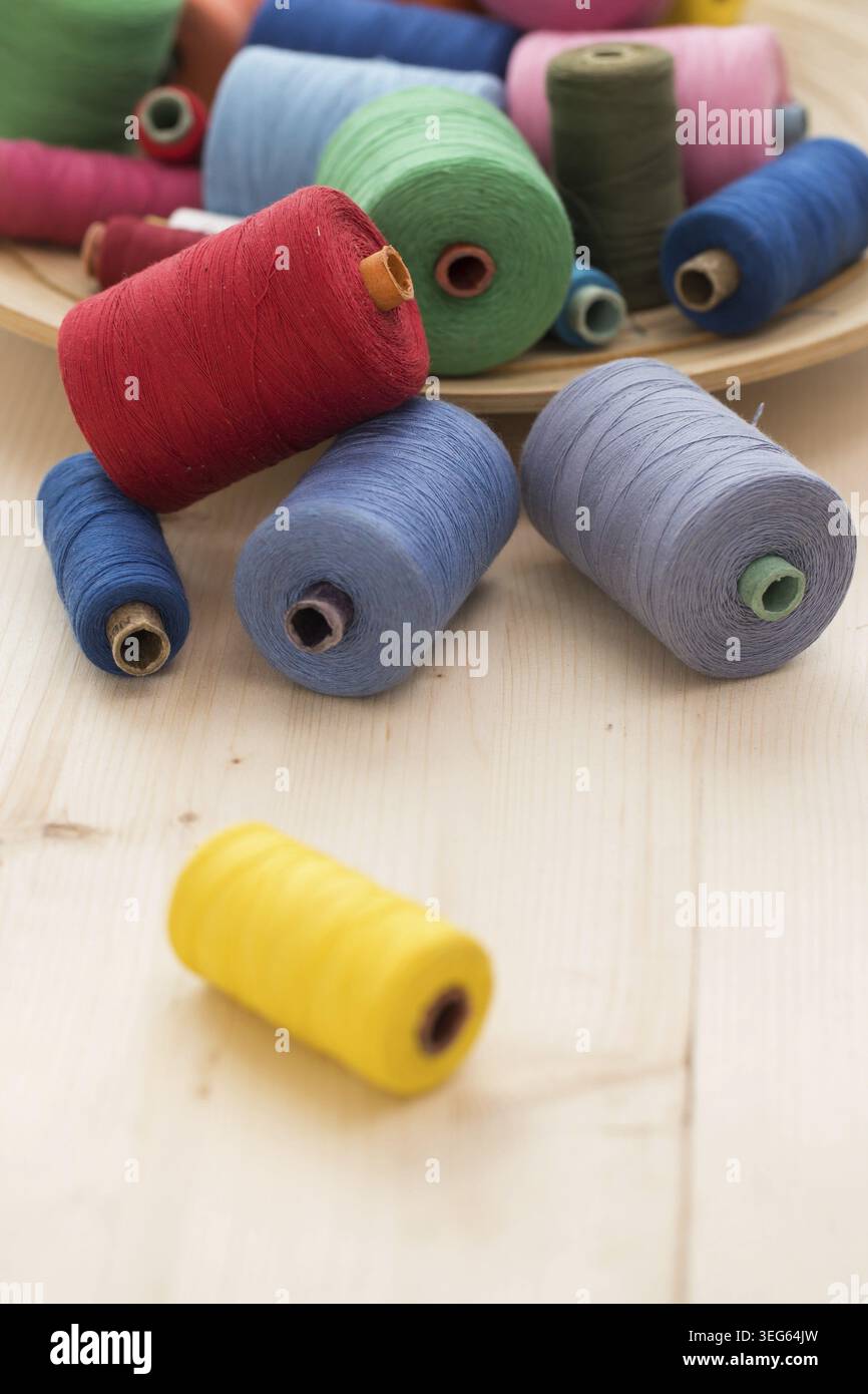 Tailoring. Many colorful threads on the table Stock Photo