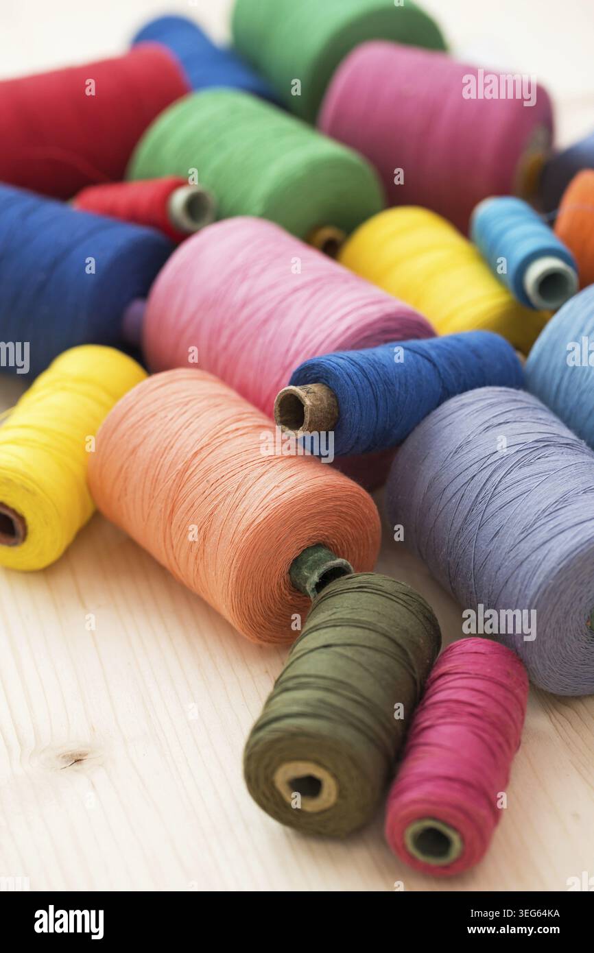 Tailoring. Many colorful threads on the table Stock Photo