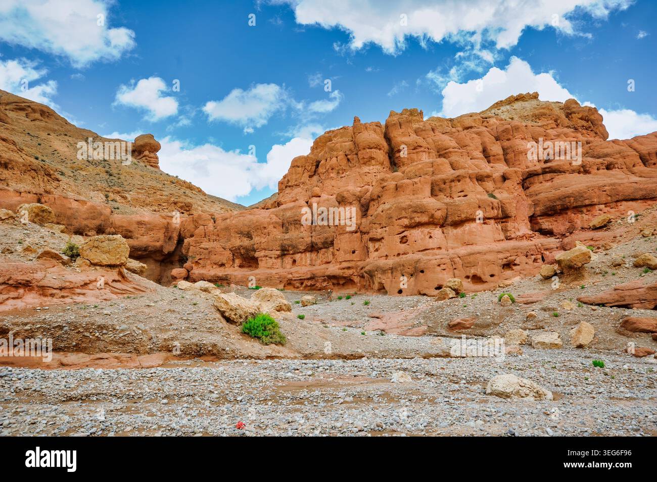 Orche Rocks Image Sunlit arid desert canyon featuring textured ochre rock formations and ...