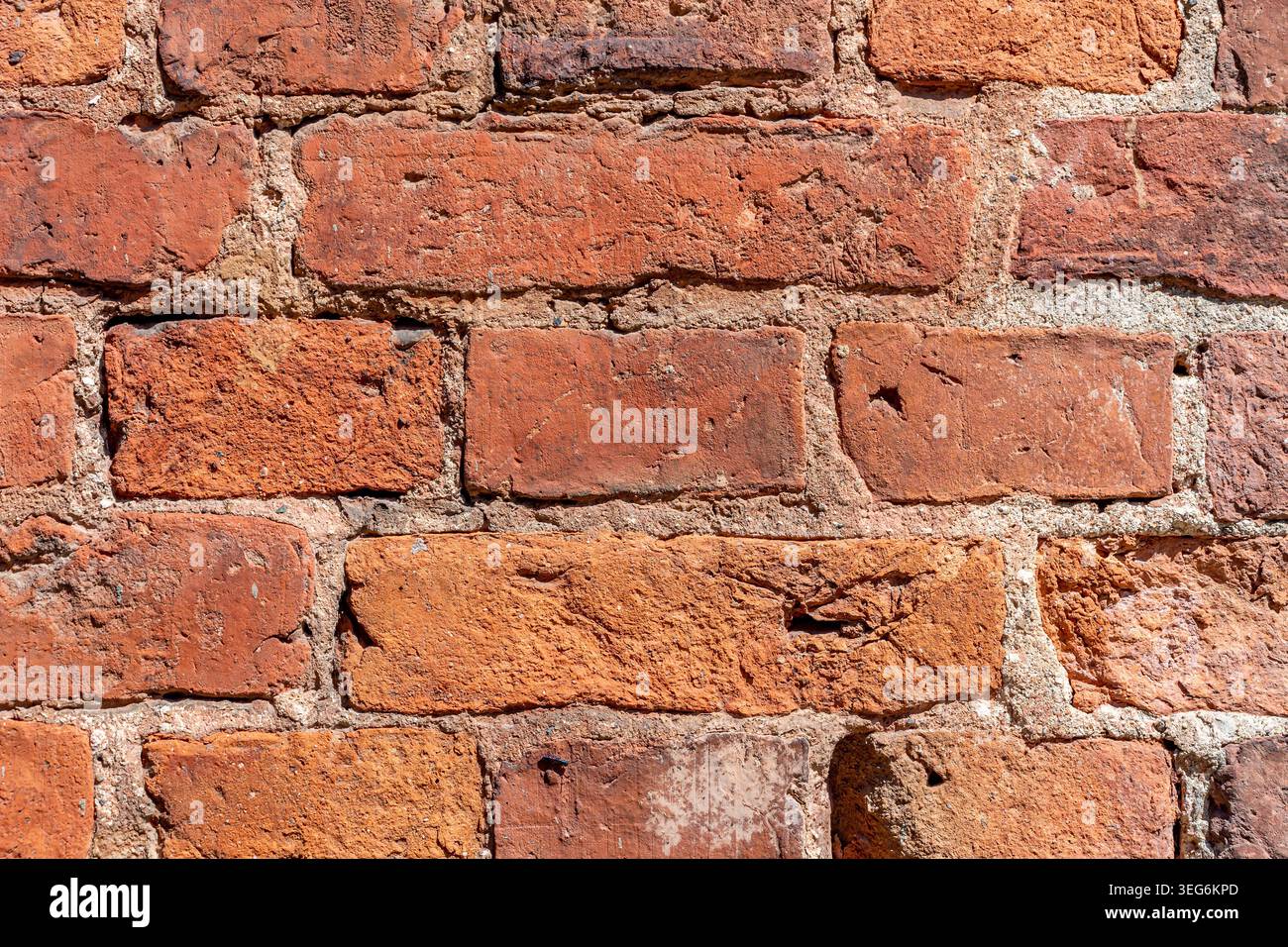 Old weathered brick wall as a creative background, close-up Stock Photo