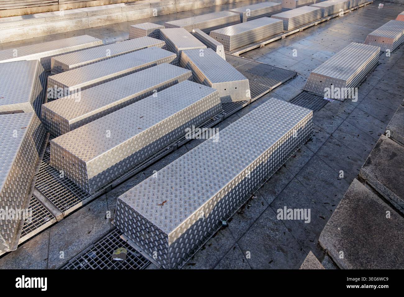Long metal boxes with diamond plate texture outdoors Stock Photo