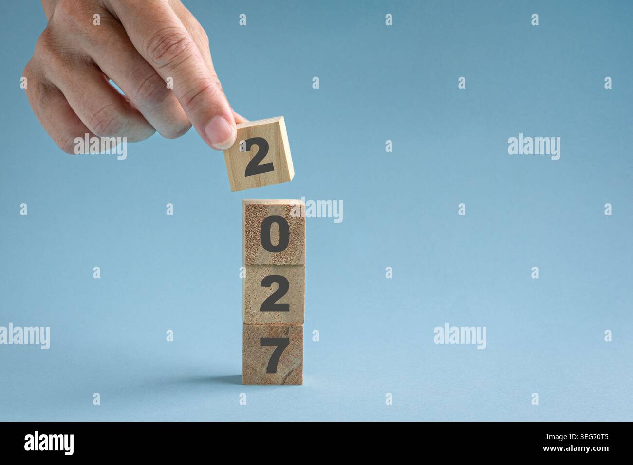 Stacking wood blocks with numbers 2027, close up view. Stock Photo