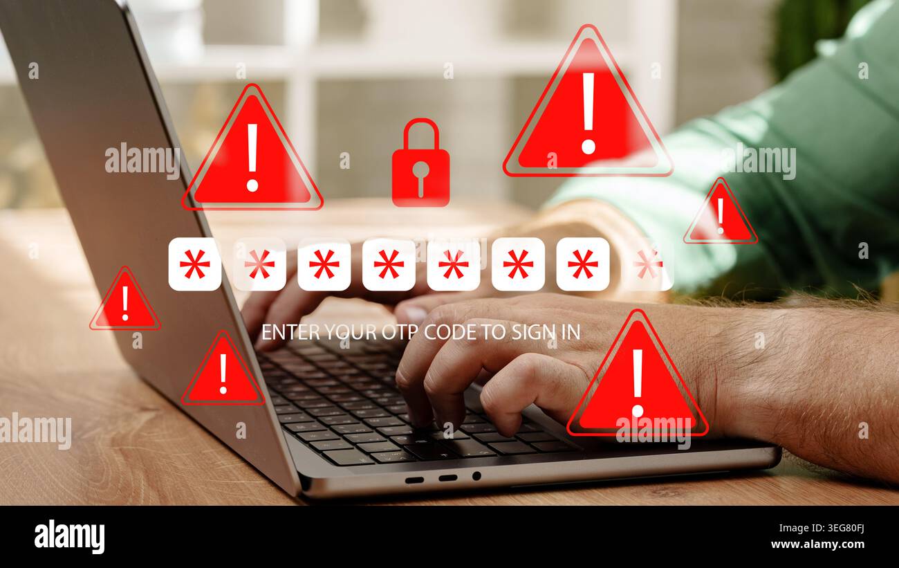 Scam message warns users to enter OTP code while typing on a laptop Stock Photo