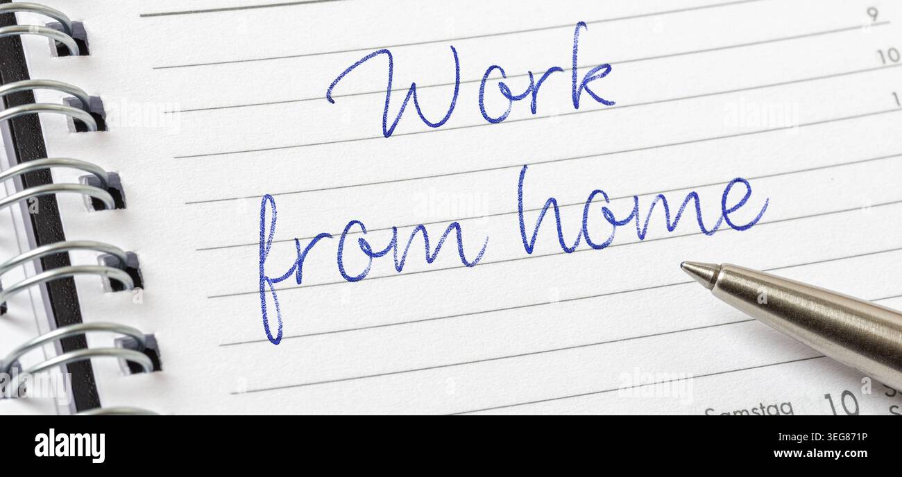 Work from home written on a calendar page Stock Photo